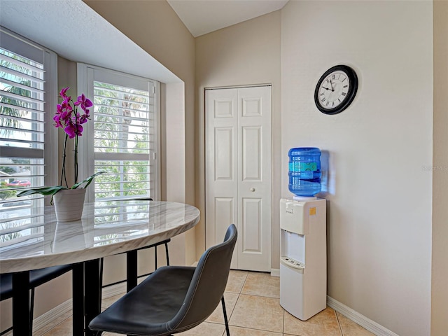 903 Addington Ct Unit 203, Venice, FL 34293 - dining area featuring baseboards and light tile patterned floors