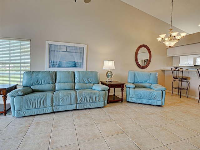 903 Addington Ct Unit 203, Venice, FL 34293 - living area featuring high vaulted ceiling, light tile patterned floors, and a chandelier