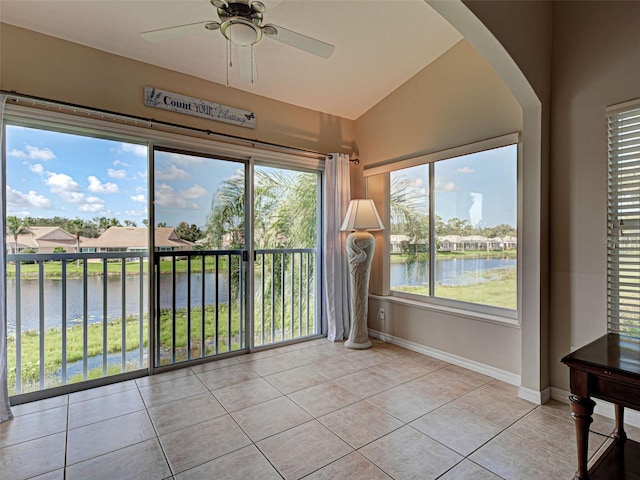 903 Addington Ct Unit 203, Venice, FL 34293 - unfurnished sunroom featuring a water view, vaulted ceiling, and arched walkways