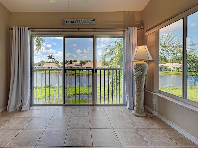 903 Addington Ct Unit 203, Venice, FL 34293 - unfurnished sunroom with a water view and plenty of natural light