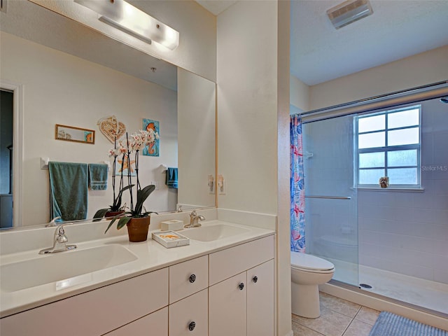 903 Addington Ct Unit 203, Venice, FL 34293 - bathroom featuring a tile shower, double vanity, and tile patterned flooring