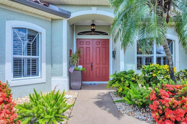 2471 Silver Palm Rd, North Port, FL 34288 - doorway to property featuring stucco siding