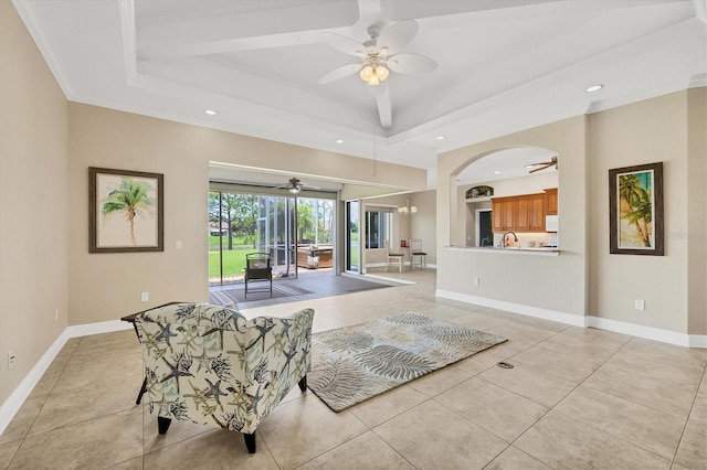2471 Silver Palm Rd, North Port, FL 34288 - living area featuring ceiling fan, light tile patterned flooring, a raised ceiling, recessed lighting, and arched walkways
