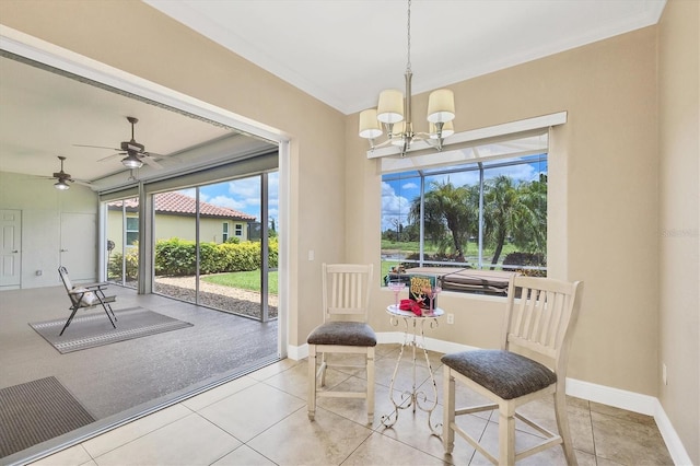 2471 Silver Palm Rd, North Port, FL 34288 - dining room featuring plenty of natural light, ornamental molding, a ceiling fan, a chandelier, and a sunroom