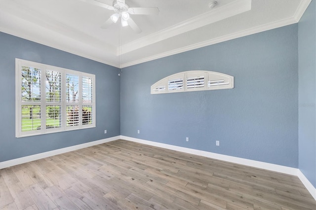 2471 Silver Palm Rd, North Port, FL 34288 - empty room featuring a raised ceiling, wood finished floors, crown molding, and a smoke detector