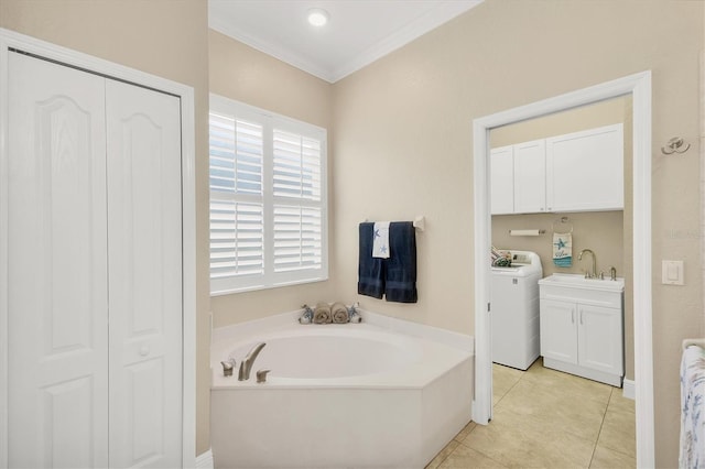 2471 Silver Palm Rd, North Port, FL 34288 - bathroom with washer / dryer, a closet, a bath, vanity, and healthy amount of natural light