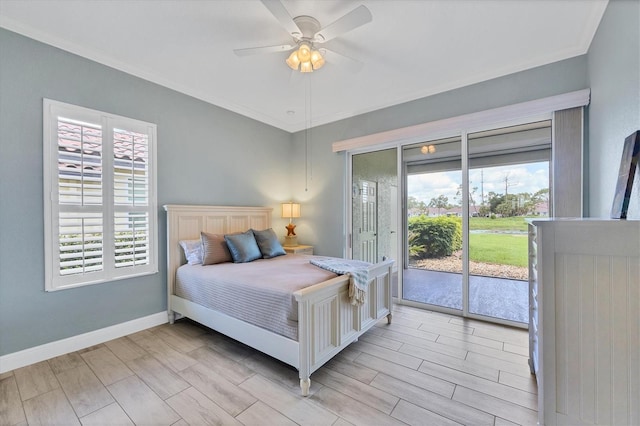 2471 Silver Palm Rd, North Port, FL 34288 - bedroom with access to exterior, multiple windows, wood finish floors, crown molding, and ceiling fan