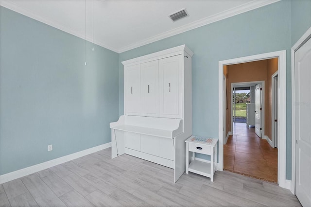 2471 Silver Palm Rd, North Port, FL 34288 - mudroom featuring crown molding and baseboards