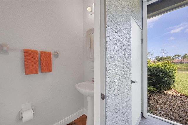 2471 Silver Palm Rd, North Port, FL 34288 - bathroom featuring baseboards