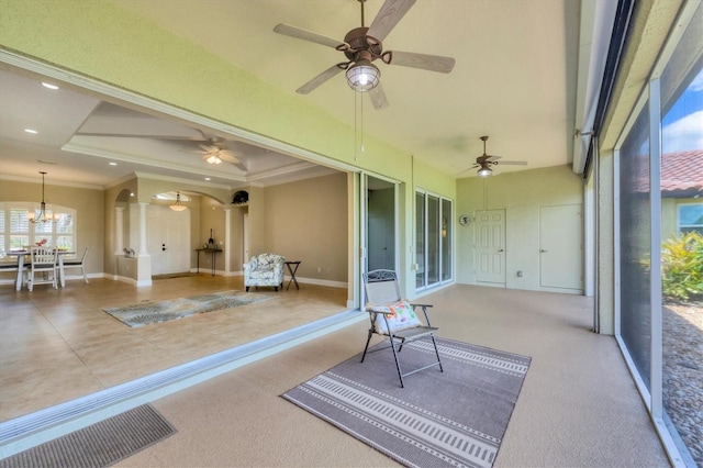 2471 Silver Palm Rd, North Port, FL 34288 - sunroom / solarium featuring ceiling fan, arched walkways, and a chandelier