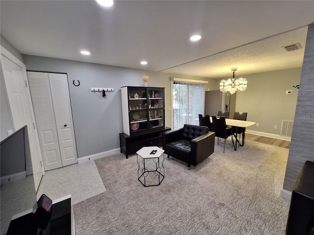 4022 Beaver Ln Unit 1000G, Port Charlotte, FL 33952 - carpeted living room featuring a chandelier and recessed lighting