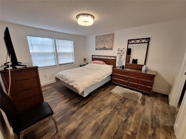 4022 Beaver Ln Unit 1000G, Port Charlotte, FL 33952 - bedroom featuring dark wood-type flooring and a textured ceiling