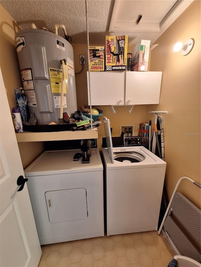 4022 Beaver Ln Unit 1000G, Port Charlotte, FL 33952 - laundry area with independent washer and dryer, water heater, cabinet space, and light tile patterned floors