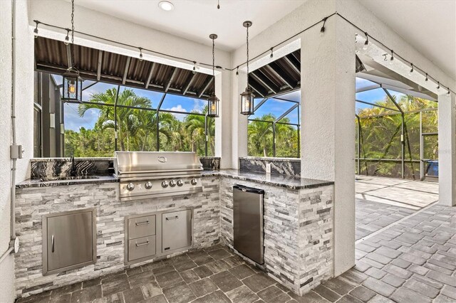 12301 Auburndale Ct, Venice, FL 34293 - view of patio / terrace featuring area for grilling, glass enclosure, and exterior bar