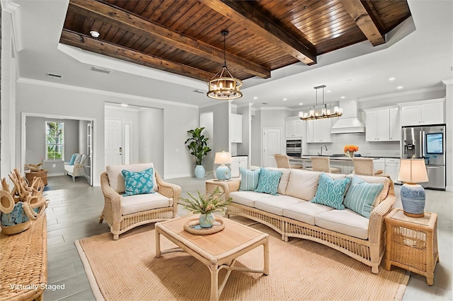 12301 Auburndale Ct, Venice, FL 34293 - living room featuring a chandelier, a wooden ceiling with exposed beams, recessed lighting, and light wood-type flooring