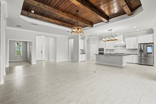 12301 Auburndale Ct, Venice, FL 34293 - kitchen with stainless steel appliances, open floor plan, a chandelier, a wood ceiling with exposed beams, and dark countertops