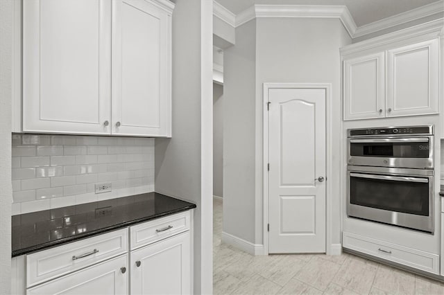 12301 Auburndale Ct, Venice, FL 34293 - kitchen with double oven, ornamental molding, white cabinets, and tasteful backsplash