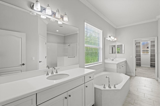 12301 Auburndale Ct, Venice, FL 34293 - bathroom featuring two vanities, healthy amount of natural light, a tile shower, ornamental molding, and a bath