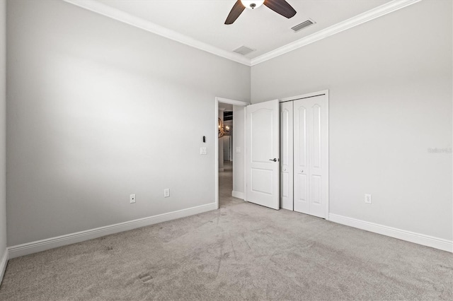 12301 Auburndale Ct, Venice, FL 34293 - unfurnished bedroom with ornamental molding, carpet floors, a ceiling fan, and a closet