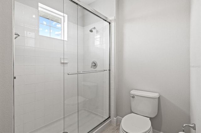 12301 Auburndale Ct, Venice, FL 34293 - full bathroom featuring toilet and a stall shower