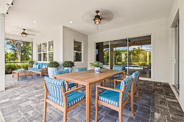 12301 Auburndale Ct, Venice, FL 34293 - sunroom / solarium featuring ceiling fan, an outdoor living space, and plenty of natural light