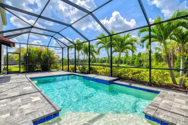 12301 Auburndale Ct, Venice, FL 34293 - outdoor pool with a lanai and a patio area