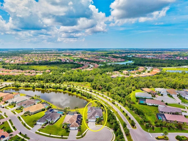 12301 Auburndale Ct, Venice, FL 34293 - aerial perspective of suburban area with a nearby body of water and a tree filled landscape