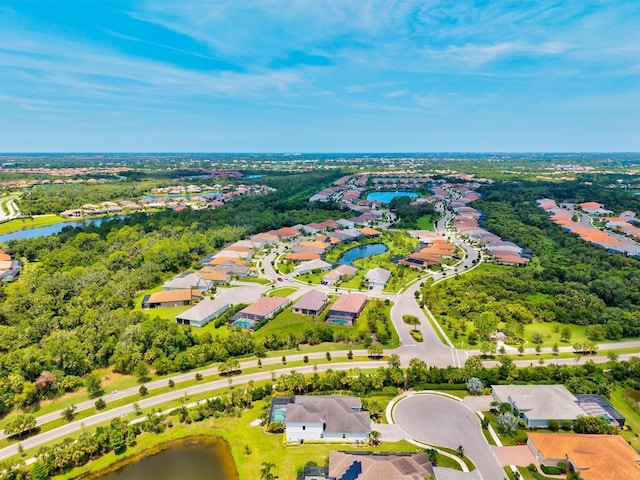 12301 Auburndale Ct, Venice, FL 34293 - aerial view of residential area with a large body of water and a tree filled landscape