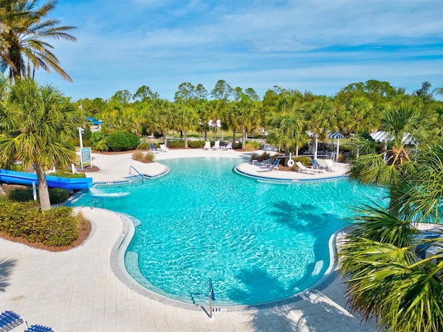 12301 Auburndale Ct, Venice, FL 34293 - community pool with a patio and a water slide