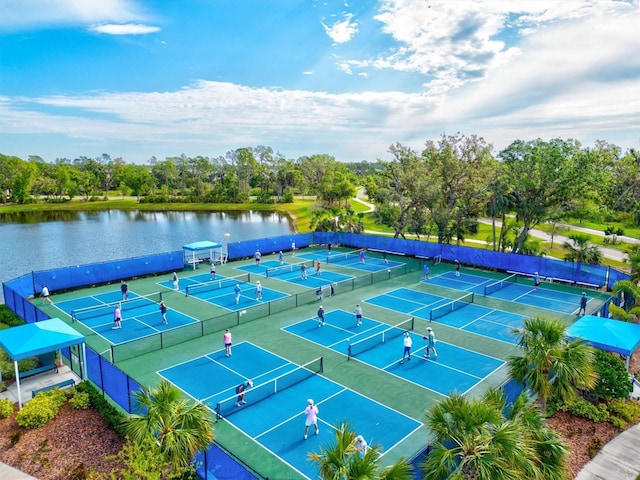 12301 Auburndale Ct, Venice, FL 34293 - view of tennis court featuring a water view and view of wooded area