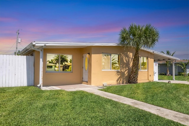 210 Duxbury Ave, Port Charlotte, FL 33952 - view of front of house featuring stucco siding and an attached carport