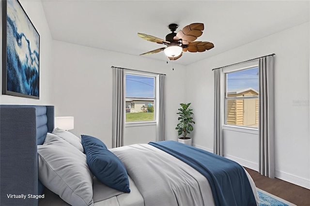 210 Duxbury Ave, Port Charlotte, FL 33952 - bedroom with multiple windows, wood finished floors, and ceiling fan