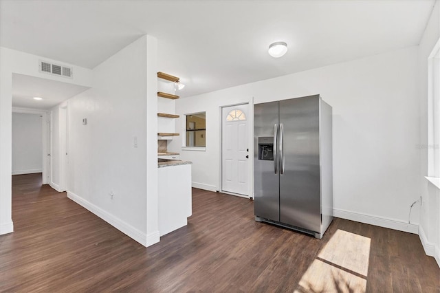 210 Duxbury Ave, Port Charlotte, FL 33952 - kitchen featuring stainless steel fridge with ice dispenser, open shelves, and dark wood-style flooring