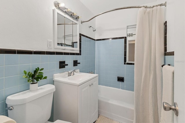 210 Duxbury Ave, Port Charlotte, FL 33952 - full bath with shower / tub combo, tile walls, vanity, and a wainscoted wall
