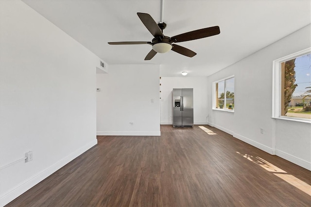 210 Duxbury Ave, Port Charlotte, FL 33952 - unfurnished living room featuring a ceiling fan and dark wood-style flooring