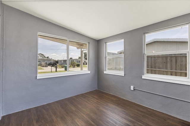 210 Duxbury Ave, Port Charlotte, FL 33952 - unfurnished room featuring lofted ceiling and dark wood finished floors