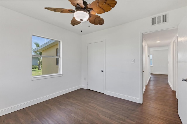 210 Duxbury Ave, Port Charlotte, FL 33952 - empty room with dark wood-style flooring and a ceiling fan