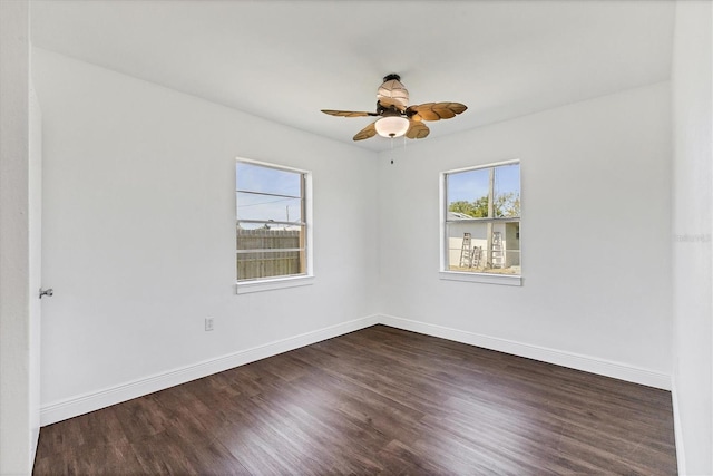 210 Duxbury Ave, Port Charlotte, FL 33952 - unfurnished room with healthy amount of natural light, dark wood-style flooring, and a ceiling fan