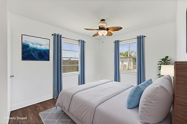 210 Duxbury Ave, Port Charlotte, FL 33952 - bedroom featuring dark wood-type flooring, multiple windows, and ceiling fan