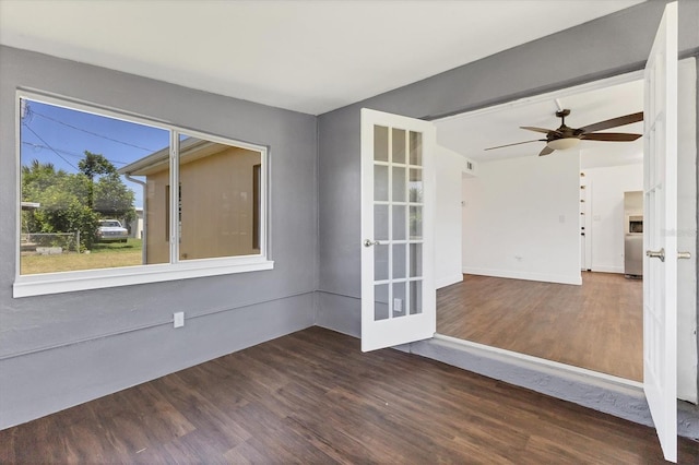 210 Duxbury Ave, Port Charlotte, FL 33952 - empty room with french doors, wood finished floors, and ceiling fan
