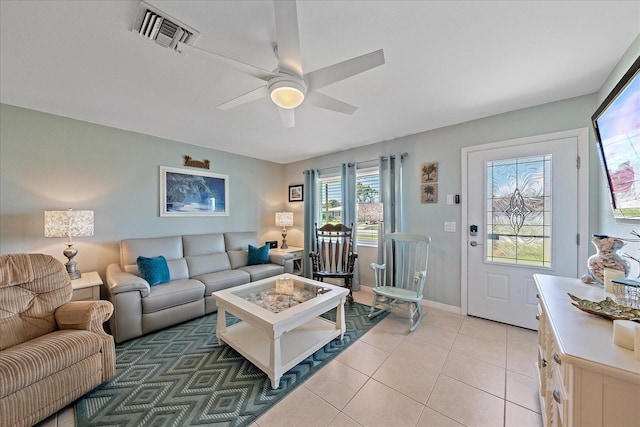 10341 Greenway Ave, Englewood, FL 34224 - living room with ceiling fan and light tile patterned floors