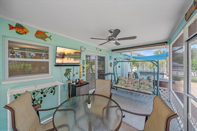 10341 Greenway Ave, Englewood, FL 34224 - sunroom / solarium with ceiling fan and outdoor dining space