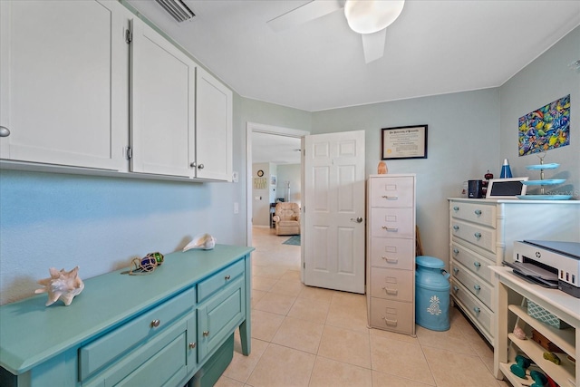 10341 Greenway Ave, Englewood, FL 34224 - kitchen featuring white cabinets, ceiling fan, light tile patterned floors, and light countertops