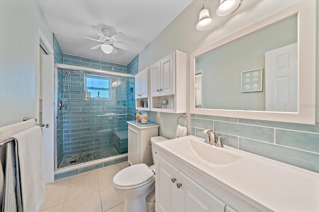 10341 Greenway Ave, Englewood, FL 34224 - full bath with a stall shower, vanity, ceiling fan, and tile patterned floors