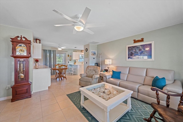10341 Greenway Ave, Englewood, FL 34224 - living area featuring light tile patterned floors and a ceiling fan