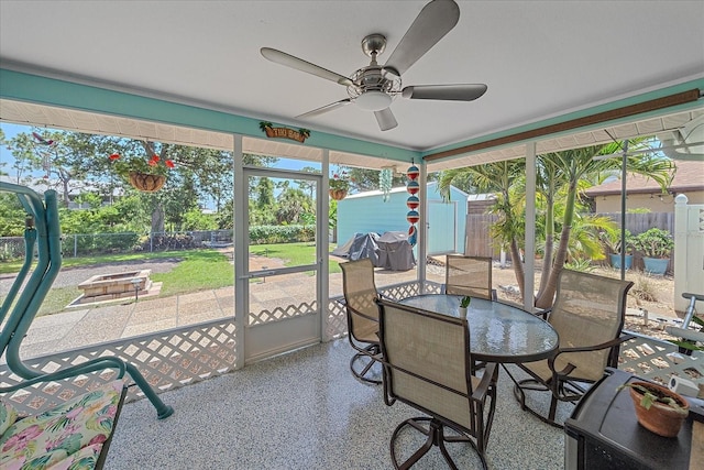 10341 Greenway Ave, Englewood, FL 34224 - sunroom / solarium featuring a ceiling fan, an outdoor fire pit, and outdoor dining area
