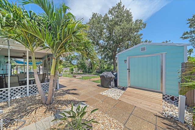 10341 Greenway Ave, Englewood, FL 34224 - view of patio / terrace featuring a shed and a grill