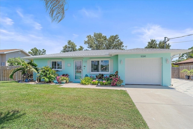 10341 Greenway Ave, Englewood, FL 34224 - ranch-style home featuring a garage, concrete driveway, and stucco siding