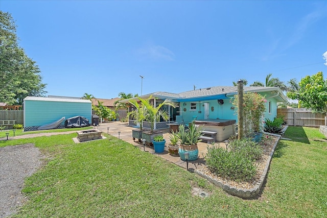 10341 Greenway Ave, Englewood, FL 34224 - fenced backyard with a hot tub and a patio