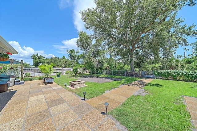 10341 Greenway Ave, Englewood, FL 34224 - fenced backyard featuring a patio area